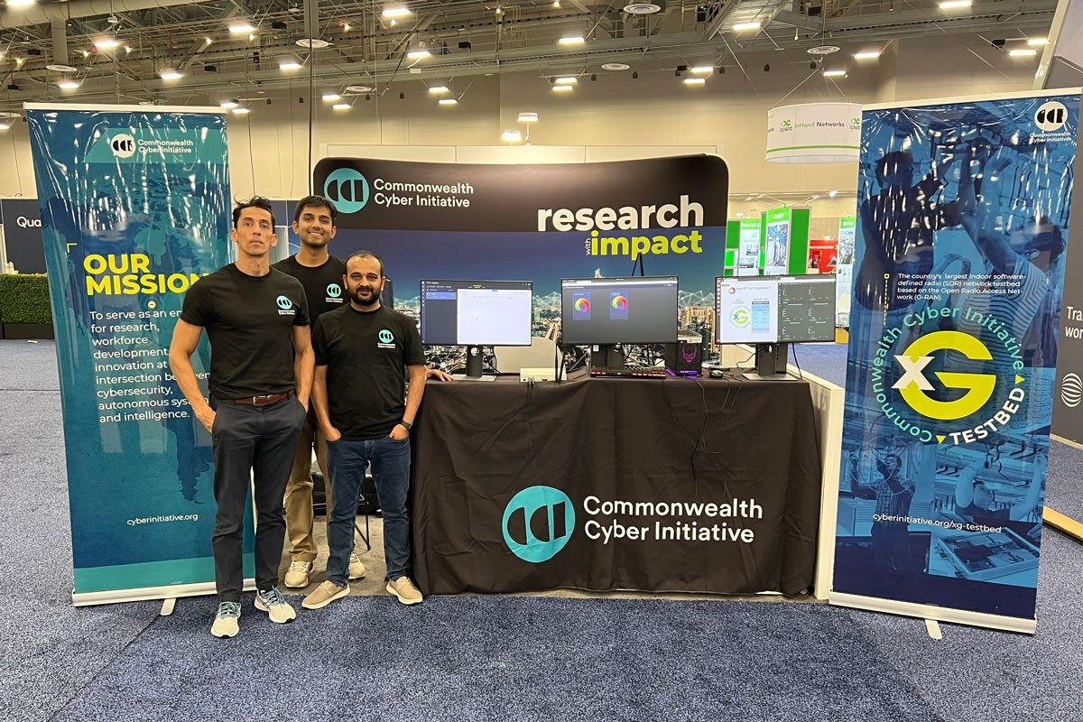 CCI team in CCI logo T-shirts at MWC booth